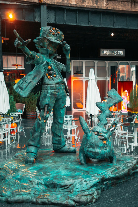 a statue of a man with a gun and a dog